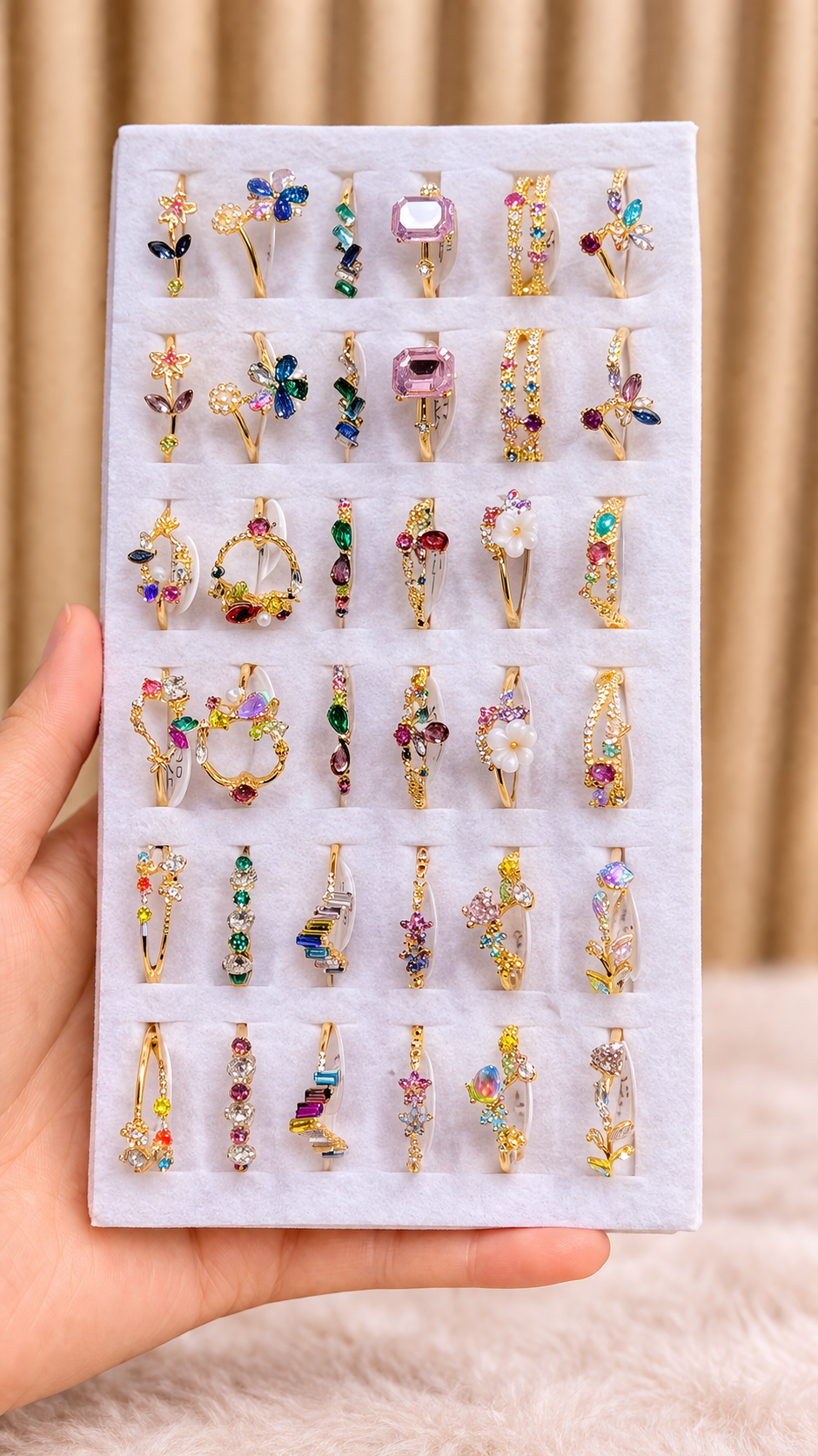 Delicate gold-tone rings with gemstones