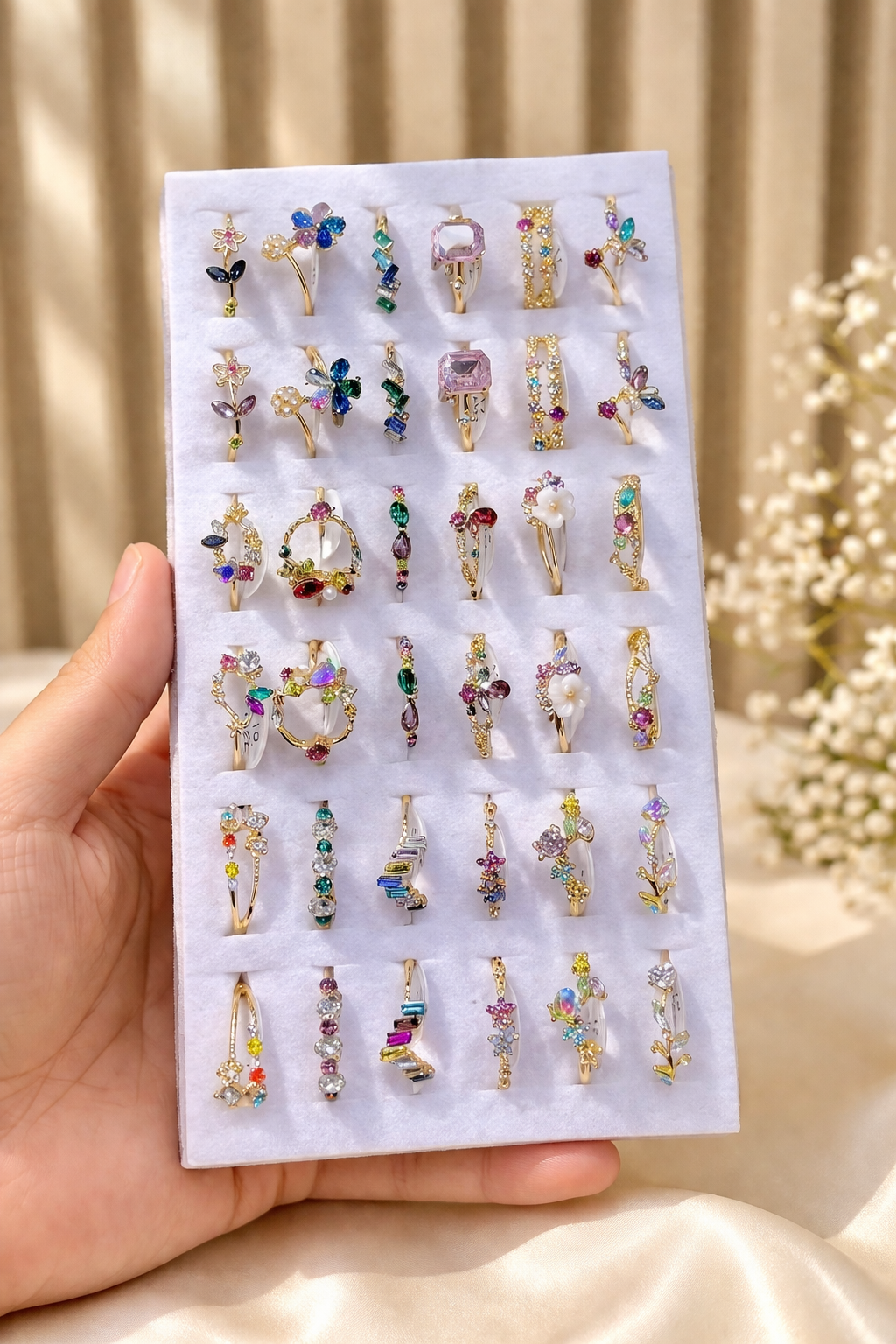 Delicate gold-tone rings with gemstones