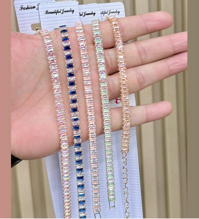 Elegant Multi-Color Baguette Crystal Tennis Bracelet Collection on Marble
